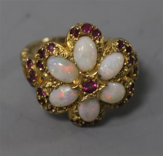 A 1970s 9ct gold, white opal and ruby cluster dress ring, size M.